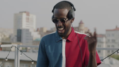happy dj on a rooftop