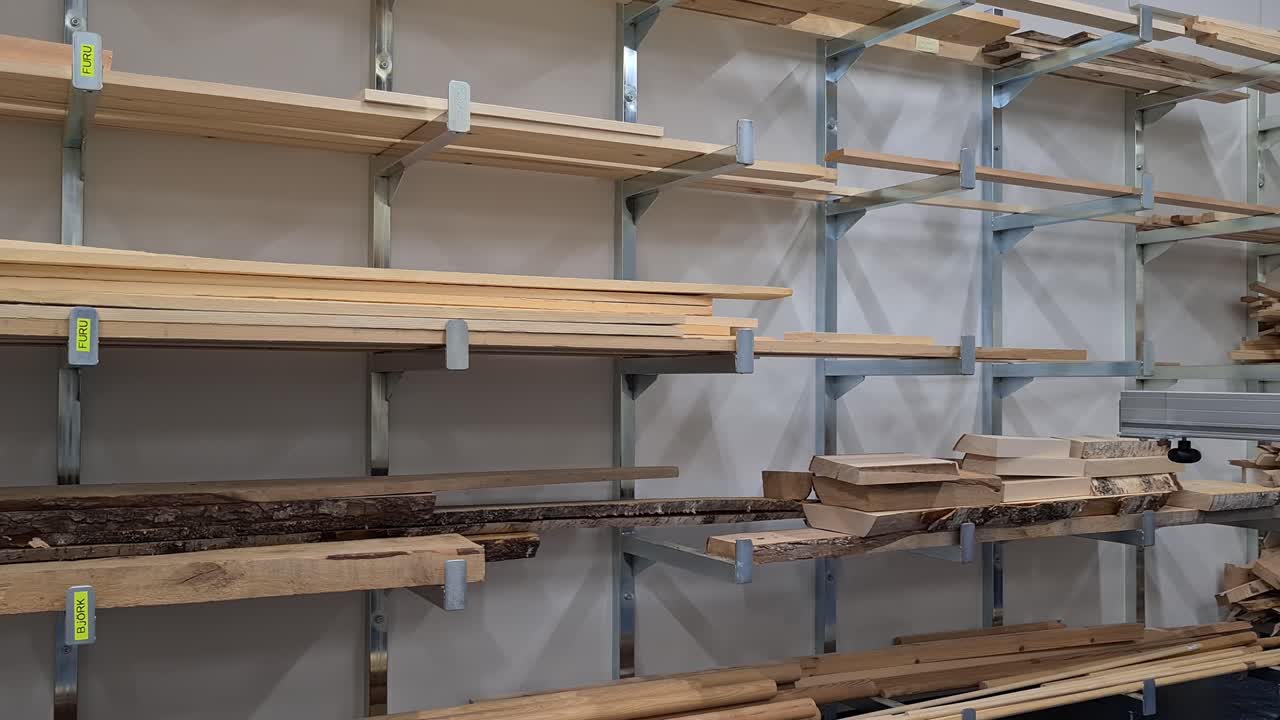 Warehouse storage Of Wood with different types of timber, Sawn lumber Boards on shelves