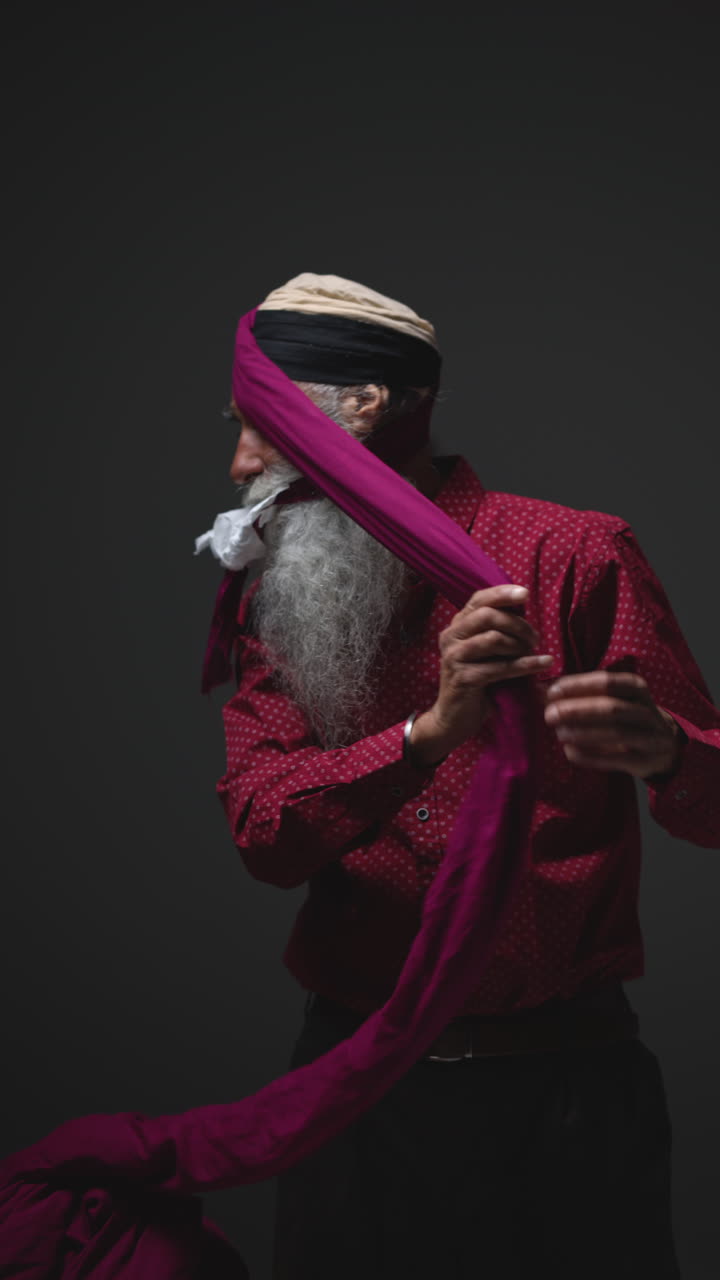 Man wearing a turban and red shirt