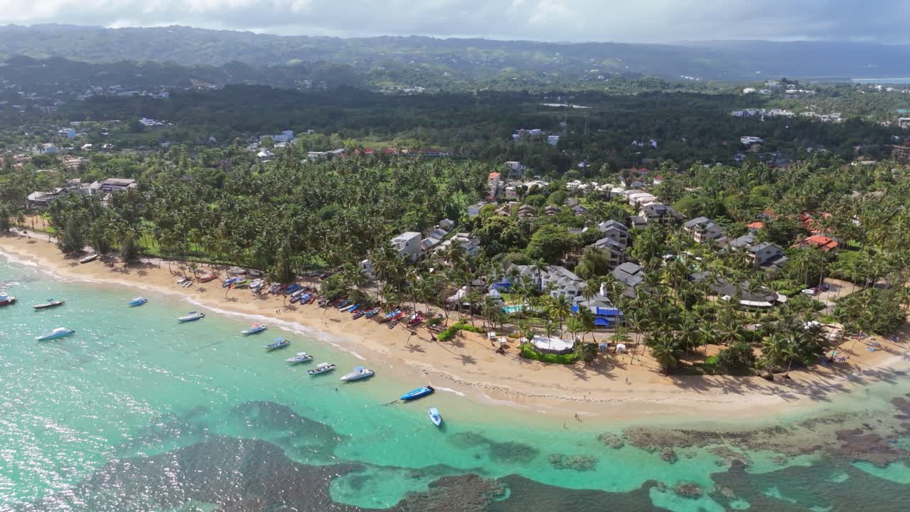Boats Floating Along The White Sandy Beach, Resort And Hotels In Las Terrenas, Dominican Republic. - aerial shot