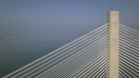 Close-up-aerial-footage-of-the-Queensferry-Crossing-bridge-at-South-Queensferry-on-a-sunny-day-in-West-Lothian,-Scotland