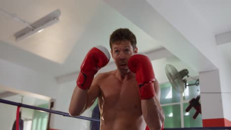 caucasian man boxing in boxing gym