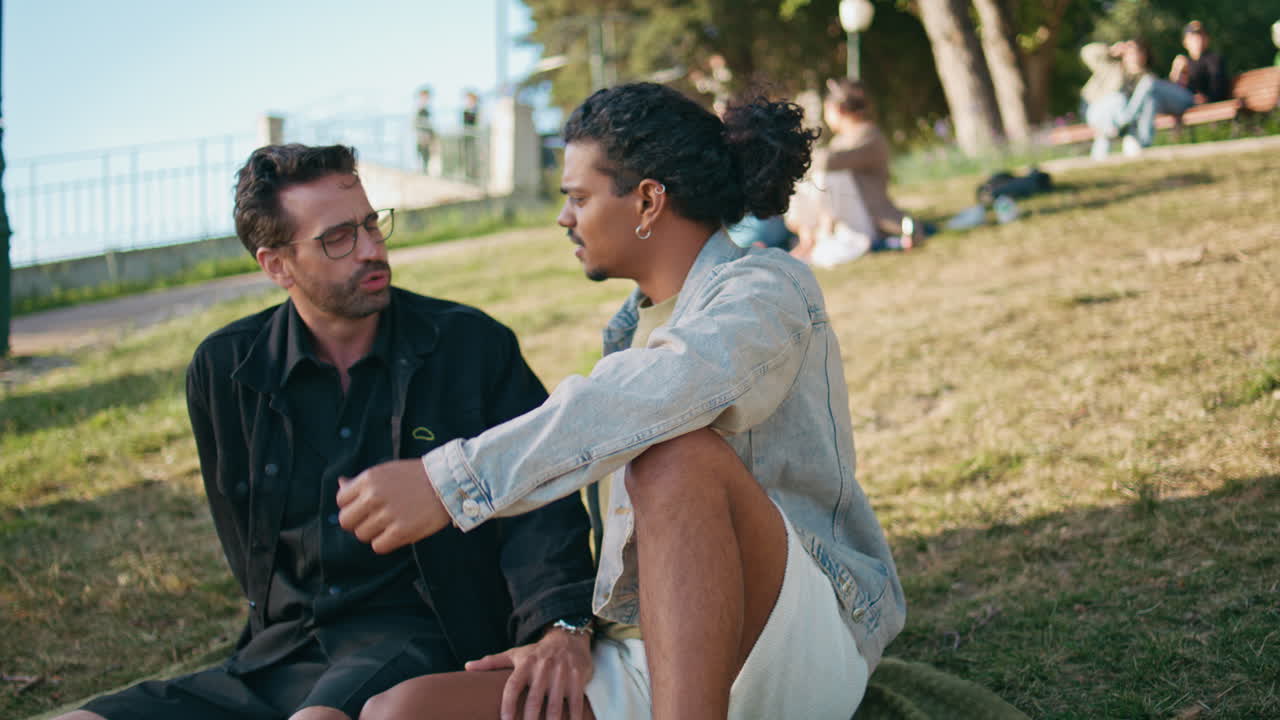 Two men talking in a park
