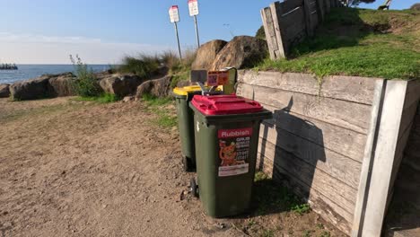 bins and steps leading to a scenic pier