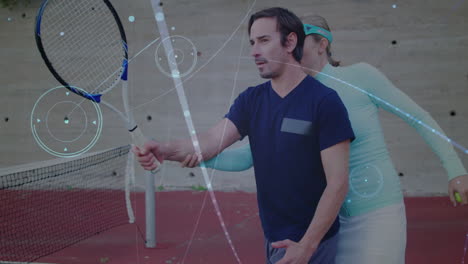 tennis coach guiding player swing at net, showing animated racket path overlay on red court