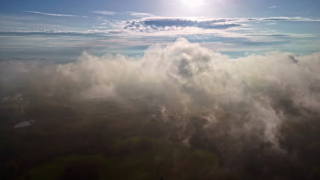 closeup of clouds, smoke floating over agricultural fields, aerial pov