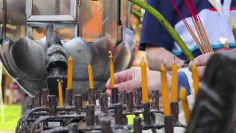 lighting candles in a religious ceremony