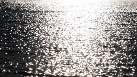 bright sunlight reflecting on ocean waves at brighton beach