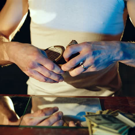 drug dealer packs a package with heroin. abuse of drugs. criminal business square video