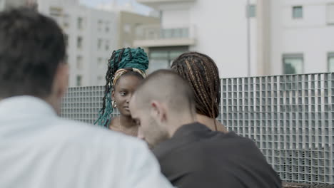 african american businesswoman talking with coworker at party