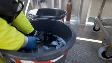 veterinarian looking for louse on salmon at the fish farm