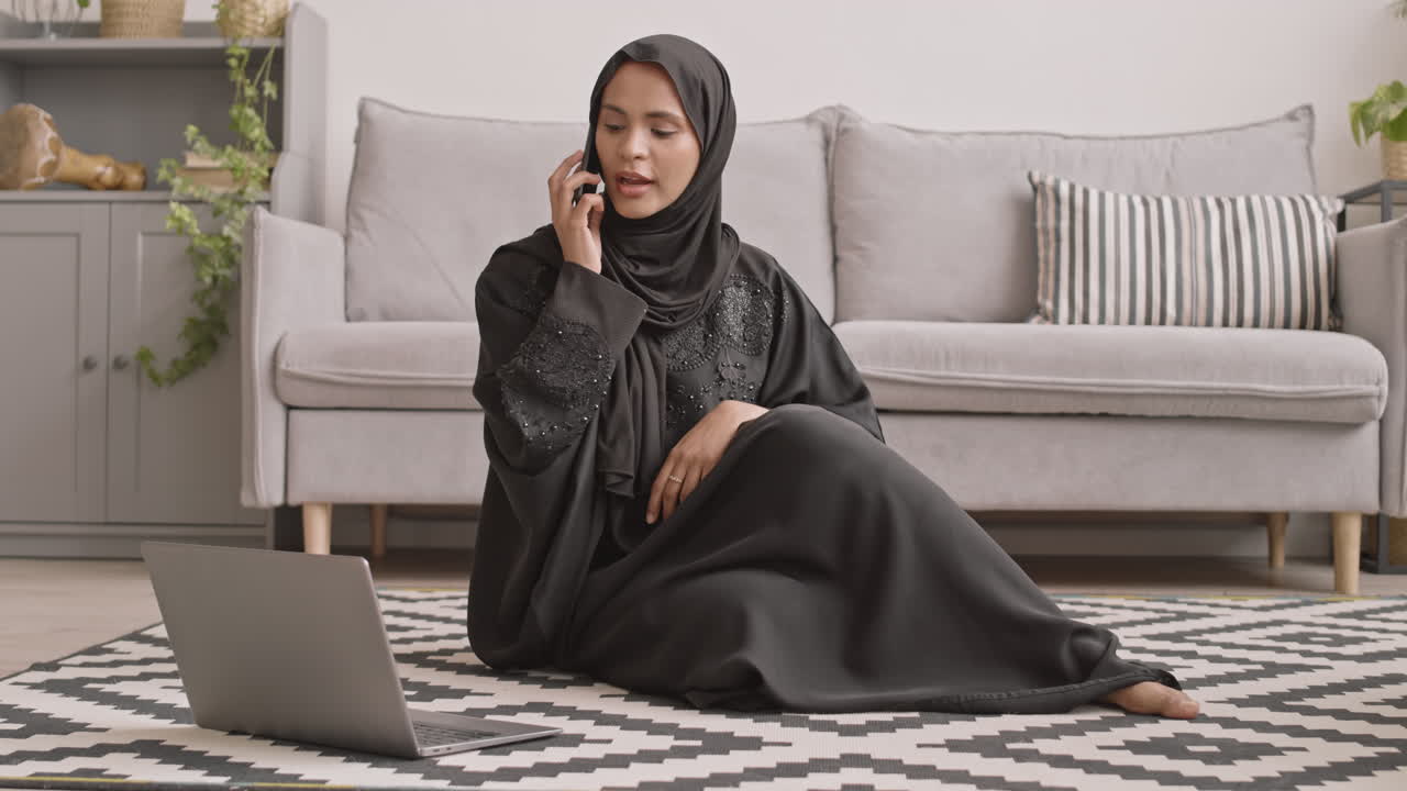 Young Muslim Businesswoman Working on Laptop from Home