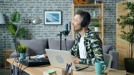 man recording a podcast in a home studio