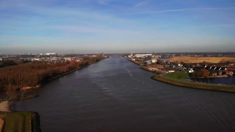 aerial dolly left across river noord on clear day