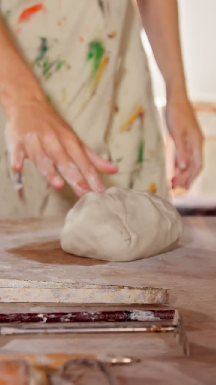 Female potter with molded clay