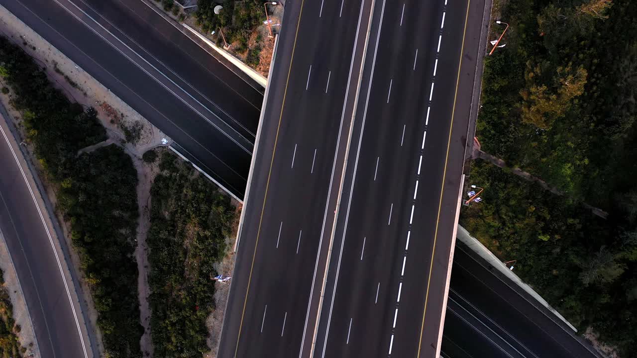 Aerial view of a highway intersection with a car