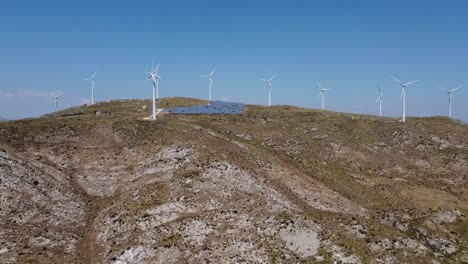 wide aerial panorama shot of windmills, wind turbines on mountain hill in sicily,italy