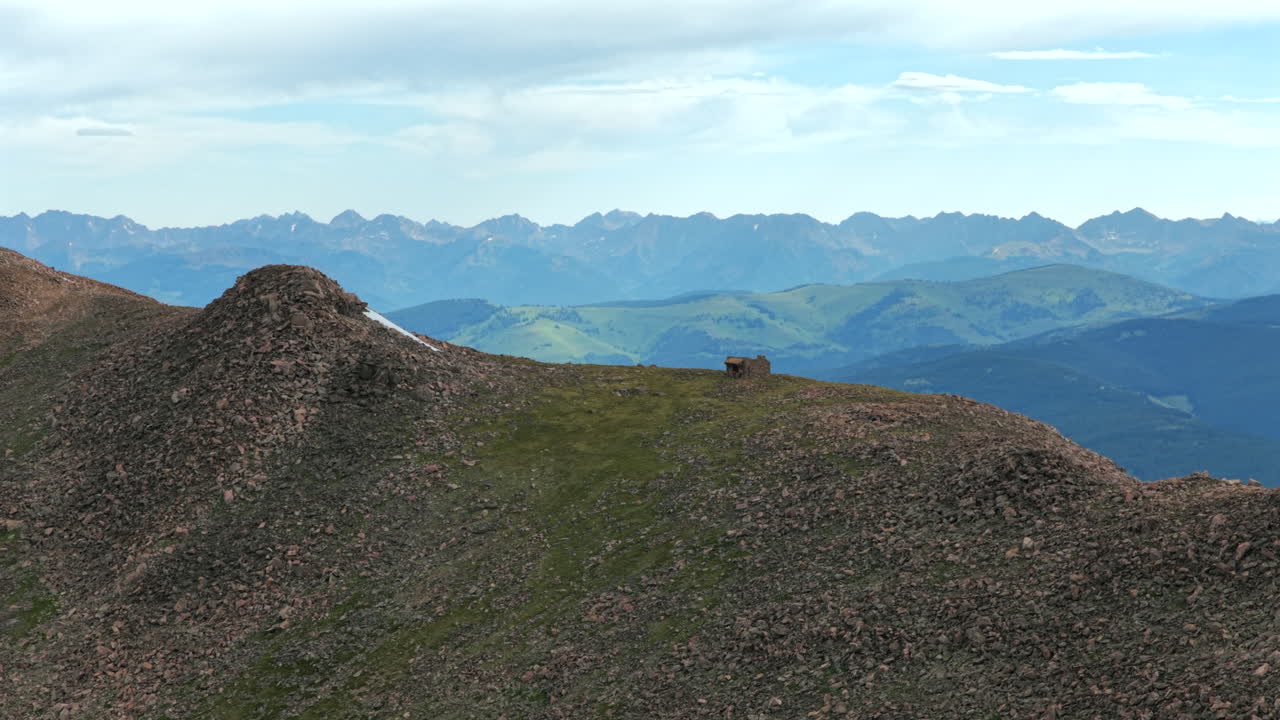 Notch Mountain Shelter morning Halo Ridge Gore Range Vail Minturn Redcliff aerial drone Colorado sunny blue sky summer Mount Holy Cross 14er peak Wilderness Sawatch Range Rocky Mountains forwards pan