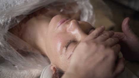 woman receiving facial treatment