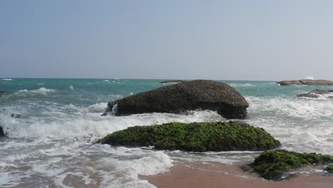 ocean wave crushing coast , awesome power of waves breaking over dangerous rocks
