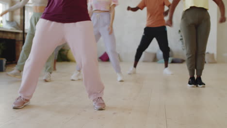 people learning dance moves during group class