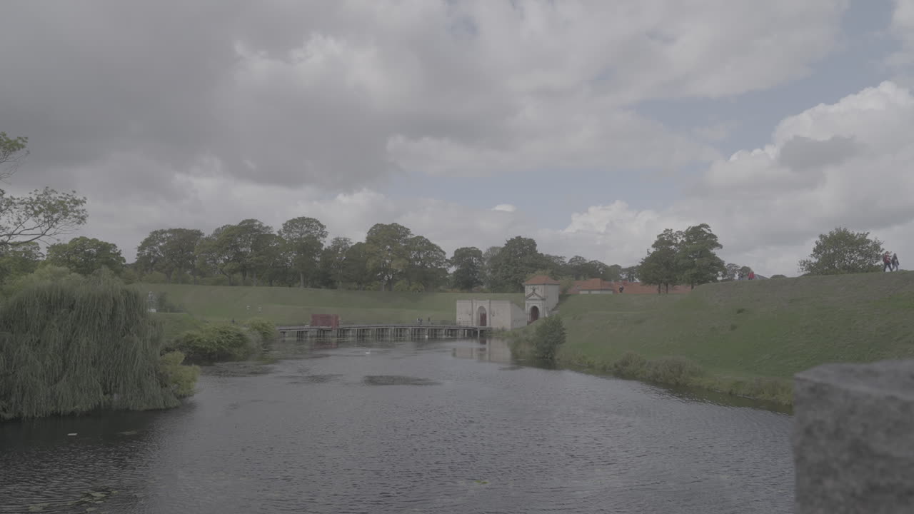 Kastellet fortress in Copenhagen Denmark on a cloudy day looking over a pong LOG