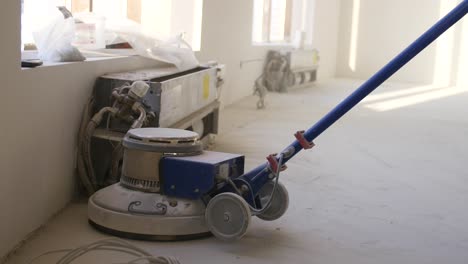 floor grinding machine on a concrete floor during construction