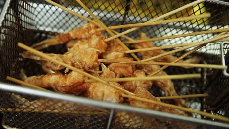 fried shrimp skewers in a fryer