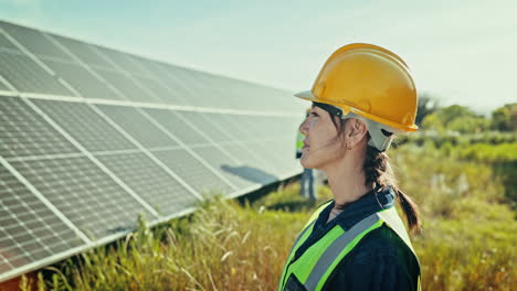 Woman-at-solar-panel-farm-for-clean-energy