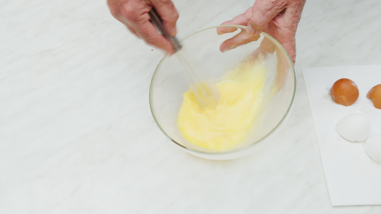 Preparing beaten eggs for an Italian omelette homemade food