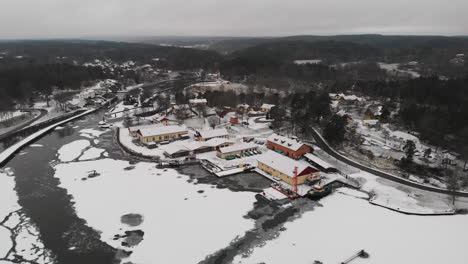 Aerial-Shot-Of-A-Frozen-River-Canal-And-Lock-In-Trollhattan-During-Winter