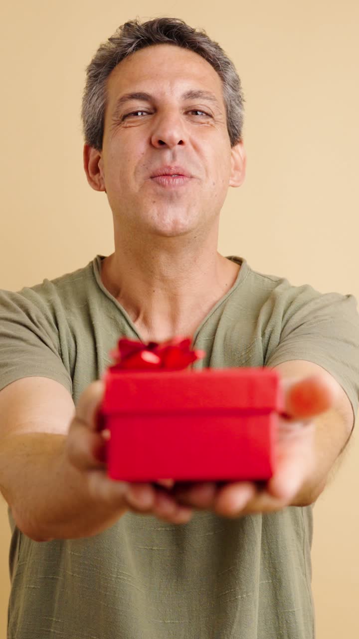Man Giving a Red Gift Box