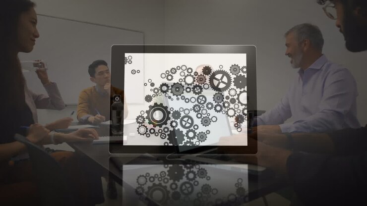 Animation of cogs spinning over business people