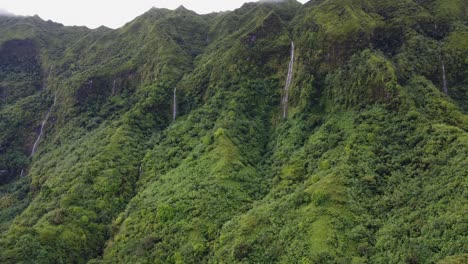 Dramatic-lush-jungle-mountain-waterfalls-on-Raiatea-Isle,-Polynesia