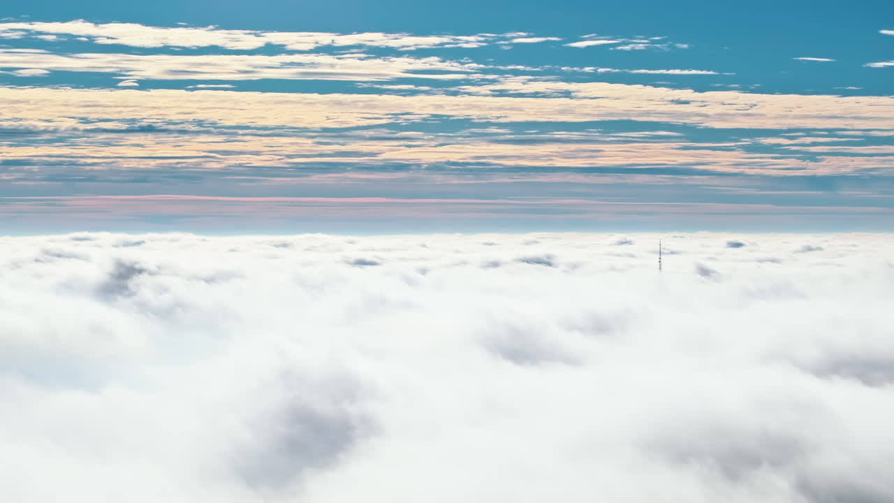 Aerial drone view of an utility pole in the clouds