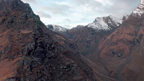 Majestic-snow-capped-mountains-with-rugged-terrains,-shot-during-daylight