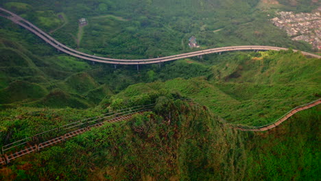 fast fly over above green mountain with copyspace, aerial tilt down, hawaii