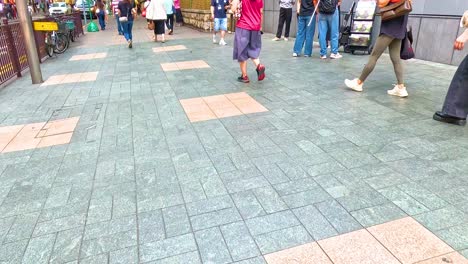 pedestrians stroll through a busy urban area