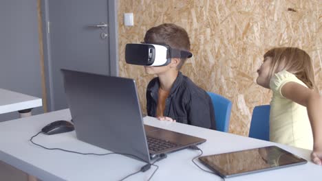 schoolboy wearing vr glasses