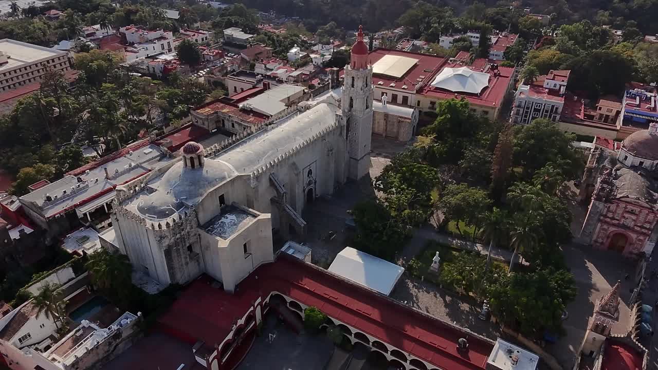 Drone View of the Majestic Historic Church in Cuernavaca, Showcasing Its Beautiful Architecture, Towering Spires, and the Lush Surroundings of the Vibrant City Below