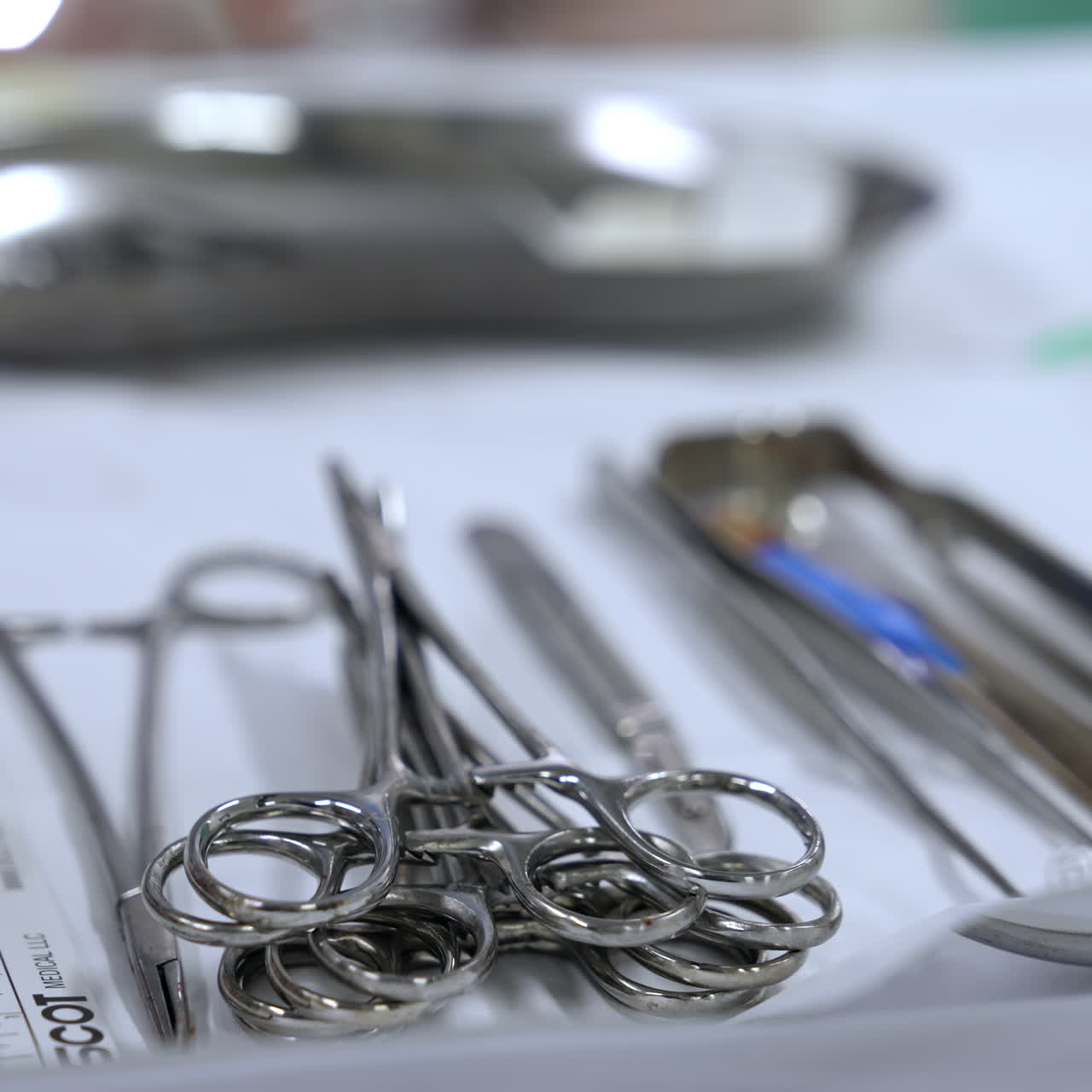 Pile of metal tools on the surgical stand. Close up. Instruments prepared for the surgery. Blurred backdrop