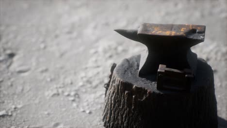 old anvil attached to a stump