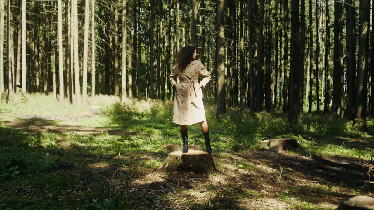 Woman in Trench Coat in Forest