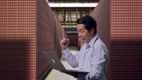 Happy Employee Celebrating Success in a Brick Factory