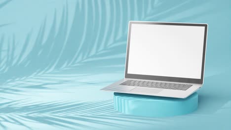 Sleek-silver-laptop-on-round-pedestal,-empty-screen-with-palm-tree-shadows-on-cool-blue-background