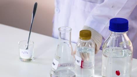 scientist arranging lab equipment for an experiment