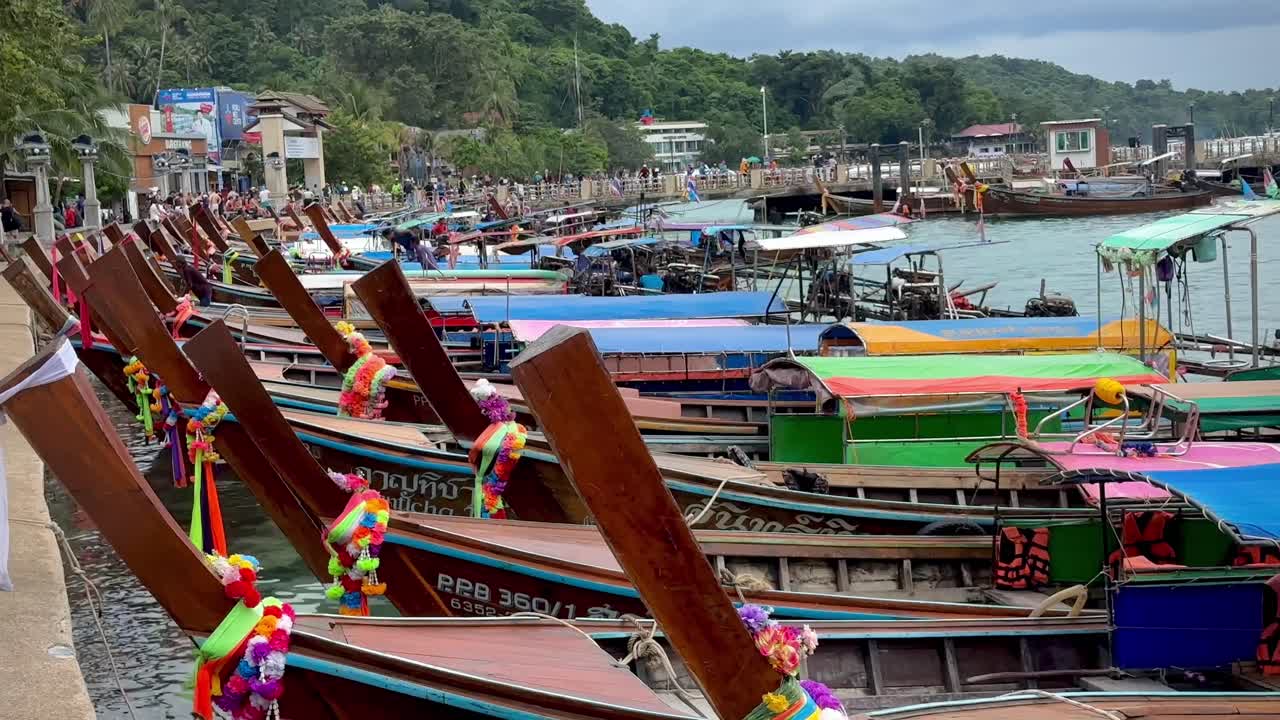 Captivating scene at Phi Phi Island's harbor unfolds in this vibrant video