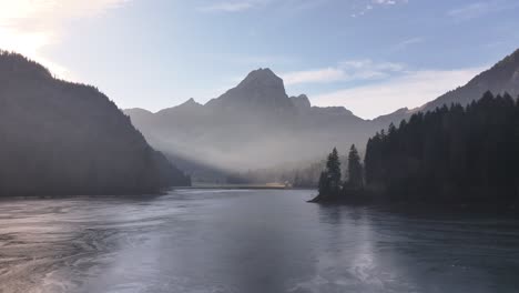 stunning view of obersee lake in switzerland on a beautiful winter morning, with the lake beginning to freeze.