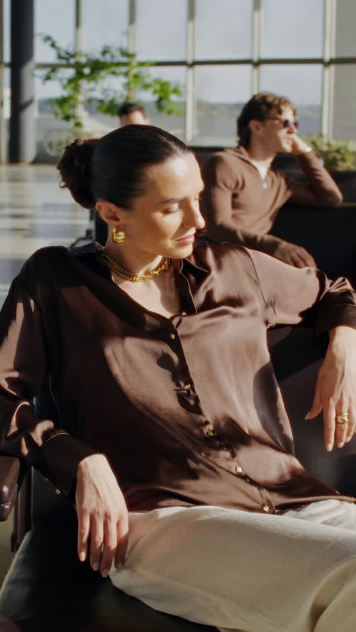 Woman Relaxing in Airport Lounge