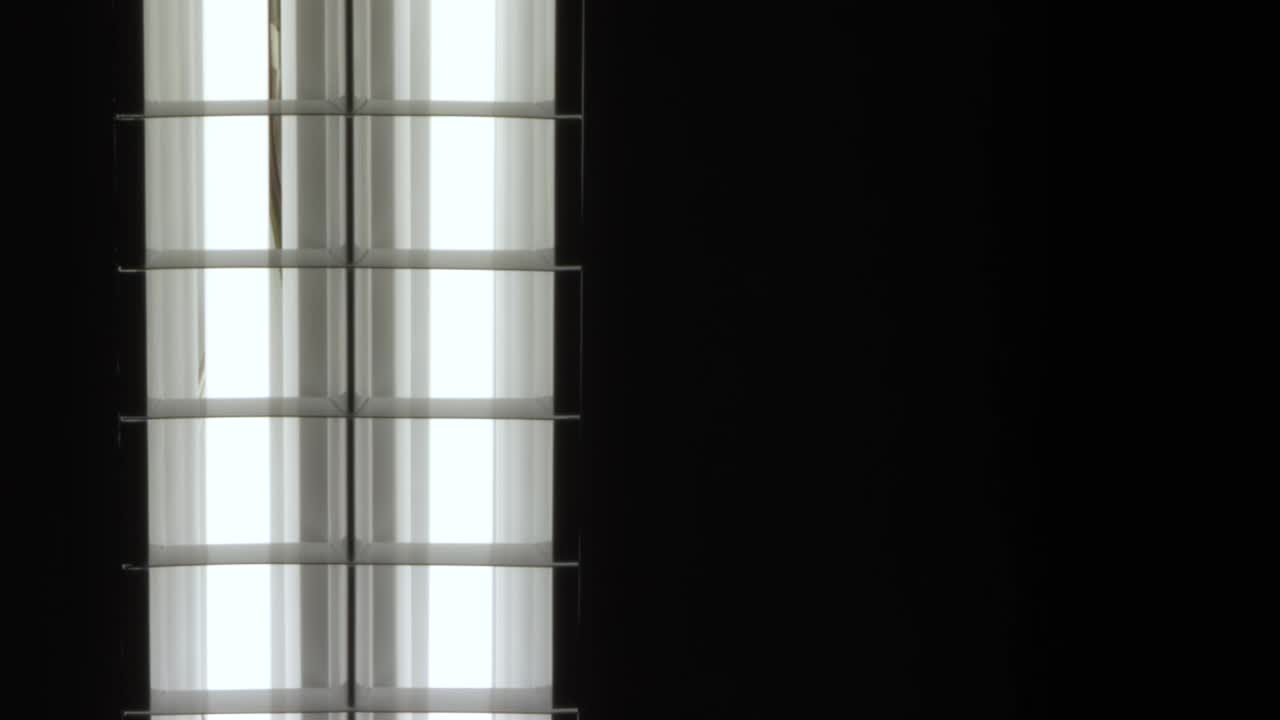 Fluorescent lights turning on and off, close-up